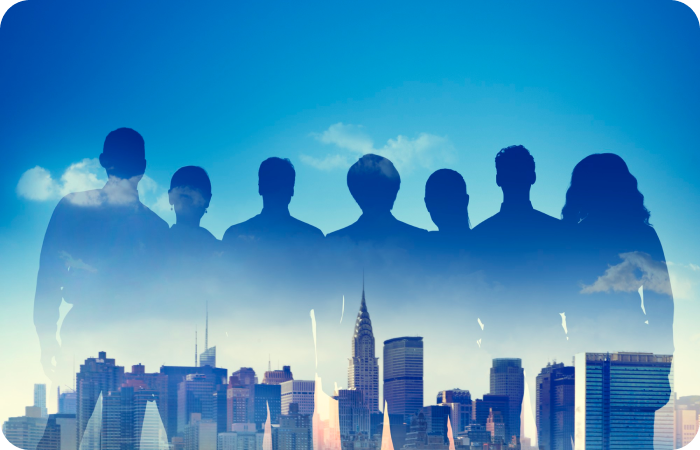 Silhouettes of the File Sender team standing before a city skyline